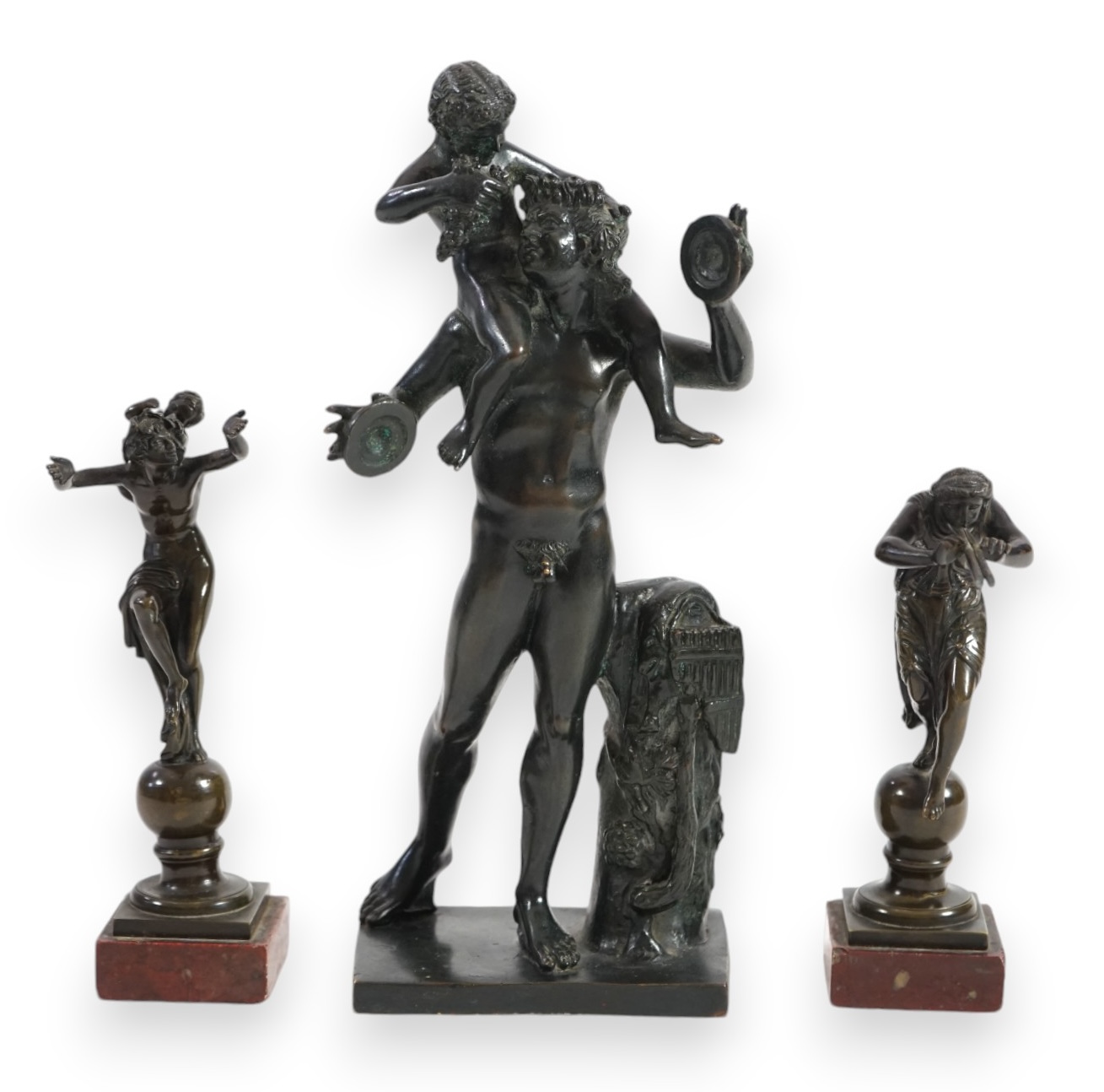 After the antique, three classical bronzes, faun with child Dionysius